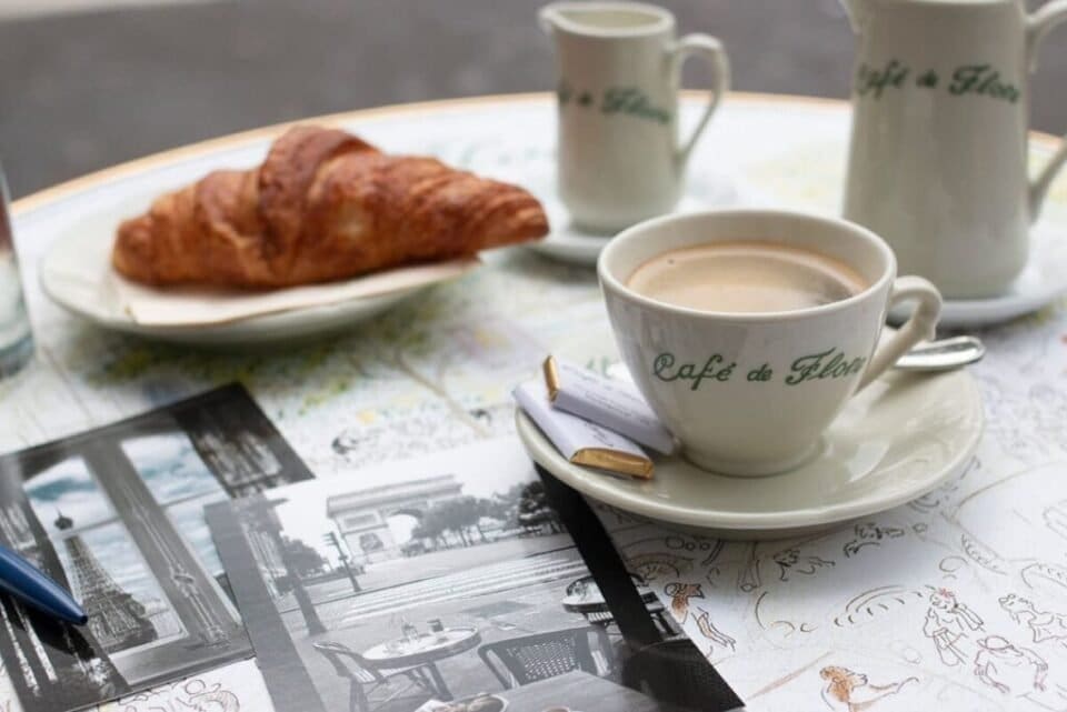 The ultimate guide to find the best croissants in Paris 22 A café with a croissant on the terrace/https://rebeccaplotnick.com